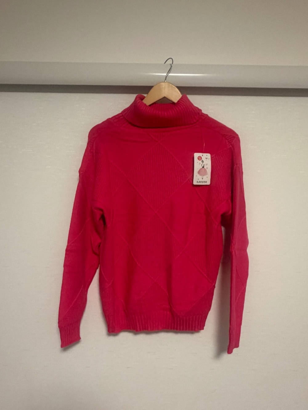 Women bright pink turtleneck sweater